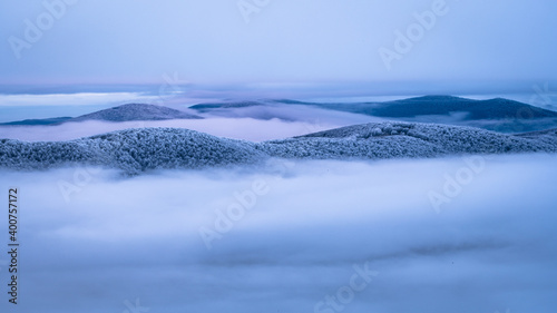 Fototapeta Naklejka Na Ścianę i Meble -  Mountain peaks over the clouds. An unigue vista. Bieszczady National Park. Carpathians. Poland.