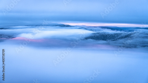 Fototapeta Naklejka Na Ścianę i Meble -  Mountain peaks over the clouds. An unigue vista. Bieszczady National Park. Carpathians. Poland.