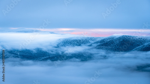 Fototapeta Naklejka Na Ścianę i Meble -  Mountain peaks over the clouds. An unigue vista. Bieszczady National Park. Carpathians. Poland.