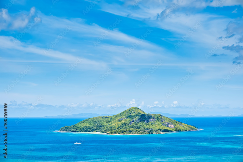 Seascape with view into St. Anne island, Seychelles, with with blue sky and clean ocean water