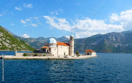 Ancient church Our Lady of the Rocks (Gospa od Skrpjela) and St. George Island in Perast, Boka Kotor Bay in Montenegro. Island of Virgin on reef. Name of island means Madonna Mother of God on Reef.