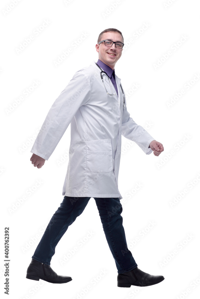 Male doctor walking isolated over a white background -side view Male doctor walking isolated over a white background -side view