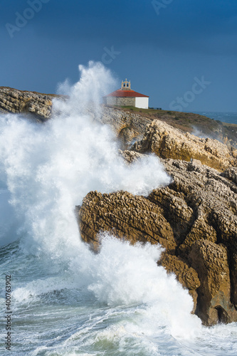 Swell and storm in the Hermitage of the Virgen del Mar in San Roman de la Llanilla in the Municipality of Santander. Cantabrian Sea. Autonomous Community of Cantabria. Spain. Europe