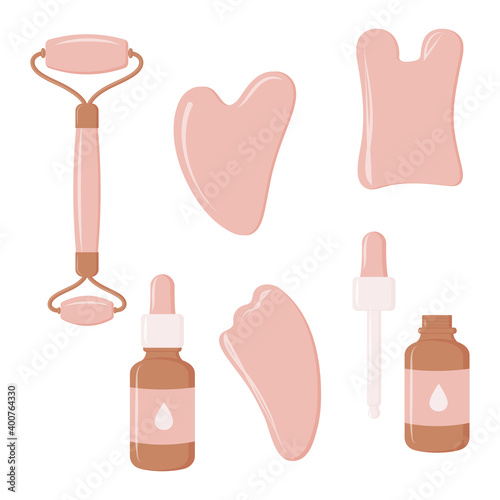 Set of tools for Gua Sha massage. Pink Gua sha scrapers, facial oil, massage roller. Home beauty routines