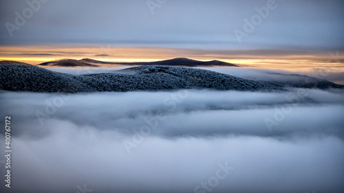 Fototapeta Naklejka Na Ścianę i Meble -  Mountain peaks over the clouds. An unigue vista. Bieszczady National Park. Carpathians. Poland.