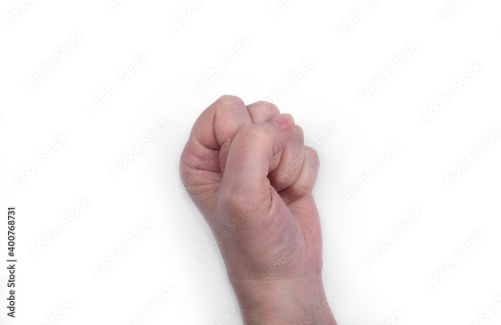 Women's hand on a white. Clenched fist Women's hand on a white. Clenched fist