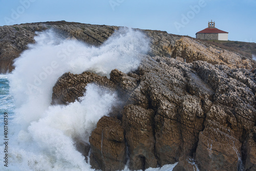 Swell and storm in the Hermitage of the Virgen del Mar in San Roman de la Llanilla in the Municipality of Santander. Cantabrian Sea. Autonomous Community of Cantabria. Spain. Europe photo