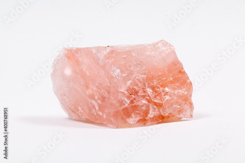 pink quartz with white background. rose stone