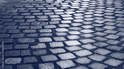 Shiny, wet pavement on the street.
