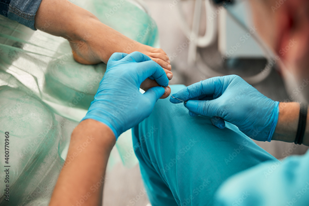 Focused photo on male hands working with medical instrument Focused photo on male hands working with medical instrument