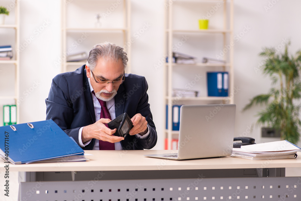Old businessman employee in bankruptcy concept Old businessman employee in bankruptcy concept