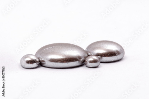 mercury mineral with white background. liquid grey mineral of mercury photo
