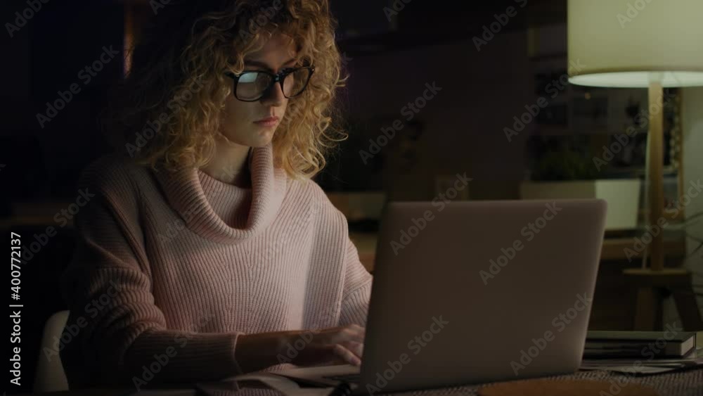 Video of tired woman working late at home. Shot with RED helium camera in 8K. Video of tired woman working late at home. Shot with RED helium camera in 8K.