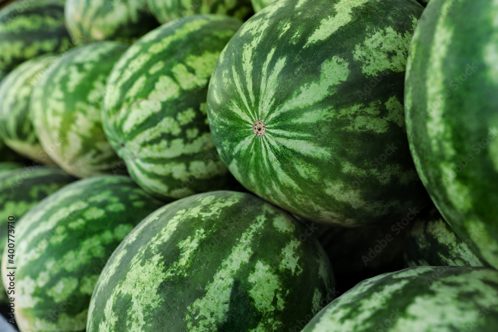 Delicious ripe watermelons as background, closeup view Delicious ripe watermelons as background, closeup view