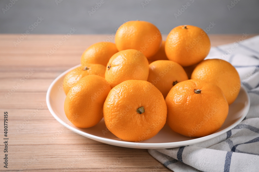 Fresh tangerines on wooden table. Citrus fruit Fresh tangerines on wooden table. Citrus fruit