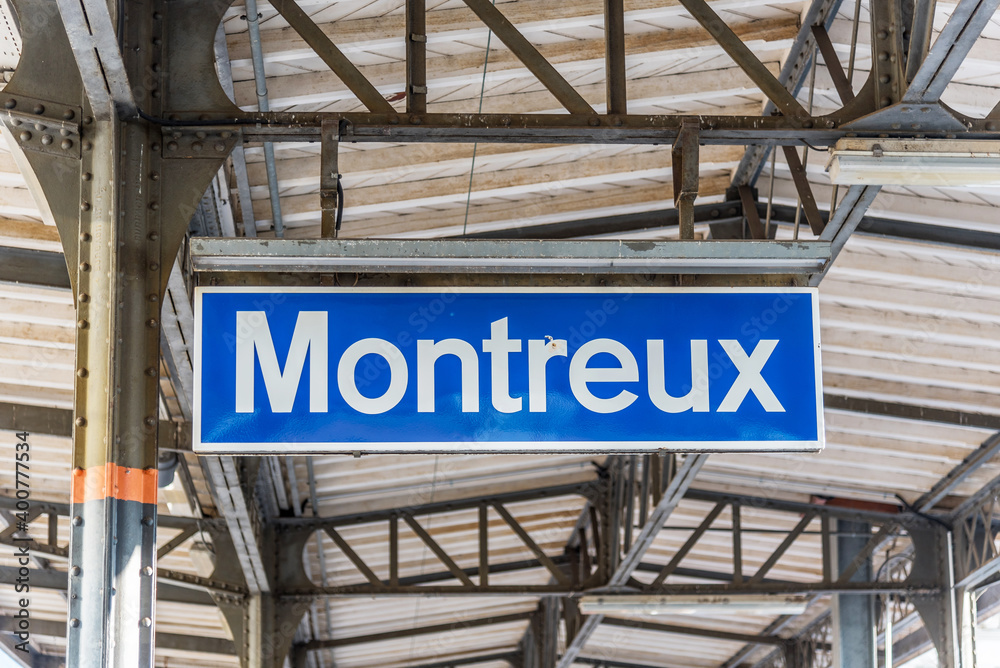 Blue sign indicating the name of a train stop in Montreux