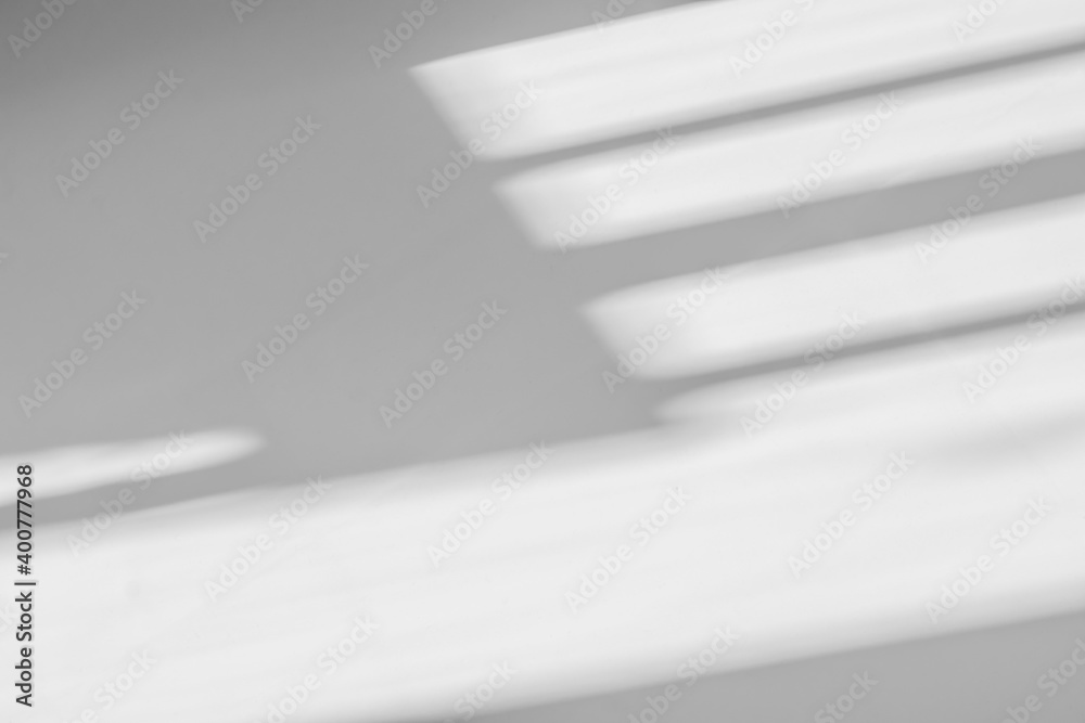 Obraz premium Abstract shadow and striped diagonal light background on white wall from window, architecture dark gray and sunshine diagonal geometric effect overlay for backdrop and mockup design