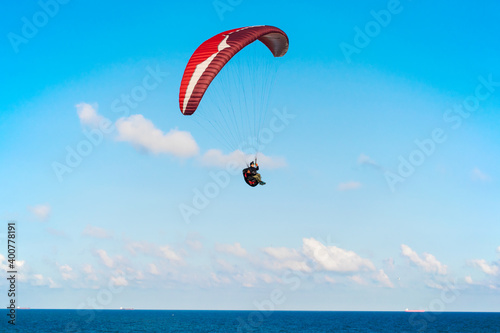 Paragliding over the sea. Paragliding sports