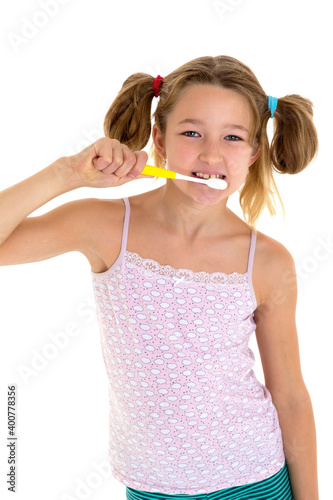 Smiling girl standing with toothbrush