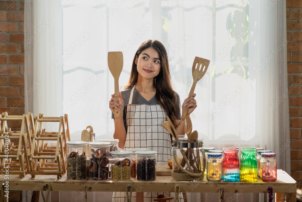 Young Asian woman cooking in the kitchen, Healthy eating lifestyle concept Young Asian woman cooking in the kitchen, Healthy eating lifestyle concept