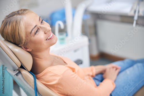 Smiling young woman waiting for dental procedures