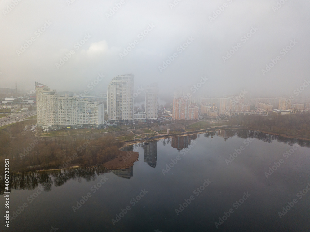 Fototapeta premium Aerial drone view. Low clouds over the Dnieper river in Kiev. Foggy autumn morning.