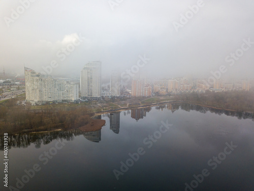 Aerial drone view. Low clouds over the Dnieper river in Kiev. Foggy autumn morning.