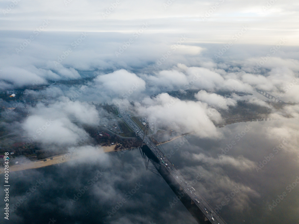 Fototapeta premium Aerial drone view. North bridge in Kiev, shrouded in morning fog.
