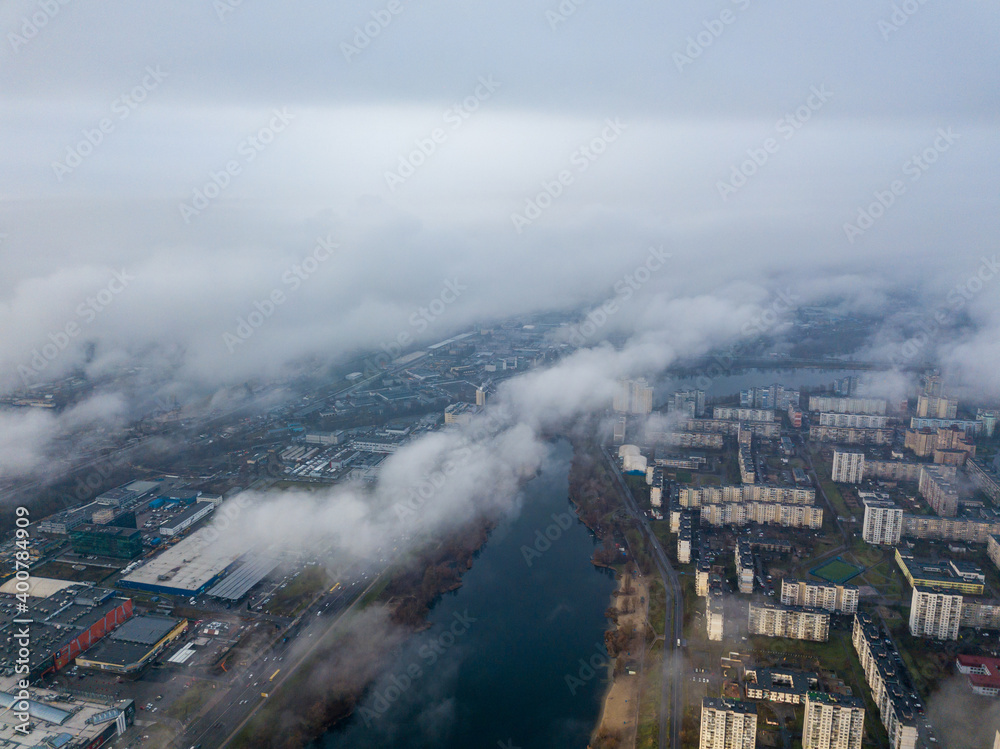 Aerial drone view. Low clouds over the Dnieper river in Kiev. Foggy autumn morning.