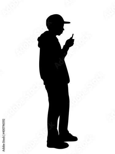 Silhouette boy looking at the phone © KozyrevaElena