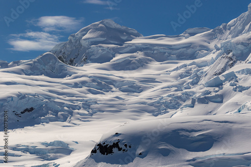 Snow-covered dunes on the mountains in Antarctica.
