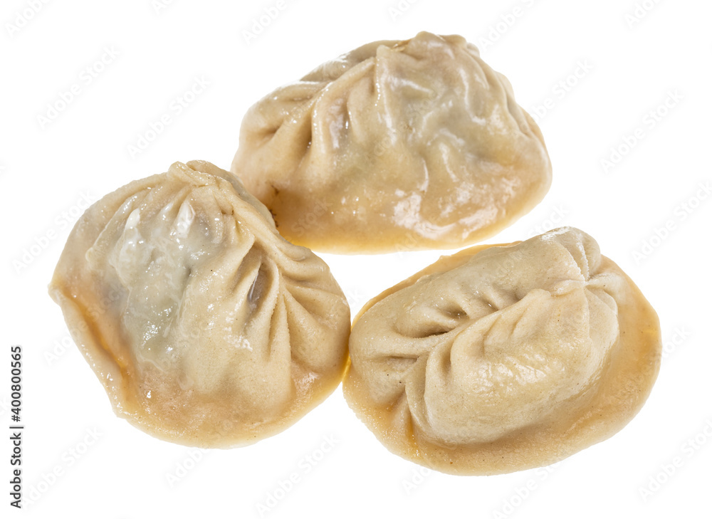 three cooked Manti (steamed dumpling stuffed with minced meat and chopped onion in central asian cuisine) isolated on white background three cooked Manti (steamed dumpling stuffed with minced meat and chopped onion in central asian cuisine) isolated on white background