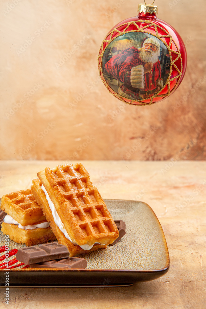 front view yummy waffle cakes with chocolate bars on brown background cookie biscuit cake sweet dessert front view yummy waffle cakes with chocolate bars on brown background cookie biscuit cake sweet dessert