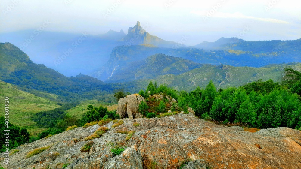 beautiful scenic view from Kodanad View Point of misty rain cloud hill mountain green forest