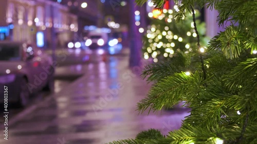 Wallpaper Mural Glowing garlands of lights on the street firs. The city is decorated for Christmas, people are walking. Background intentionally out of focus Torontodigital.ca
