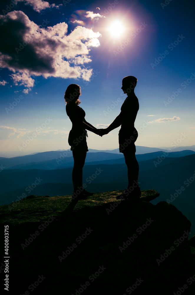 A guy and a girl look at each other at a height
