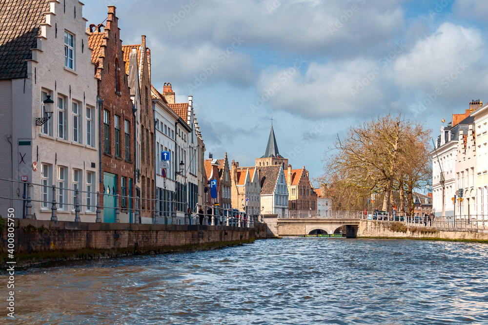 picturesque old houses along the banks of the river in the historical part of Bruges. Belgium