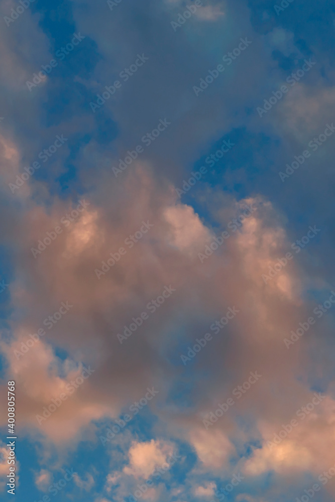 Beautiful sunlit golden clouds in the evening sky