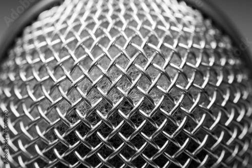 Close up photo of microphone texture. Microphone grid © Vadym
