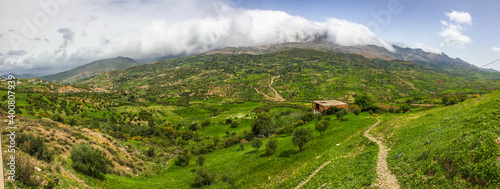 Panorama of hills and mountains with the fog clouds by the road N2 between Tetouan and Chefchaouen near city Achekrade © marketanovakova