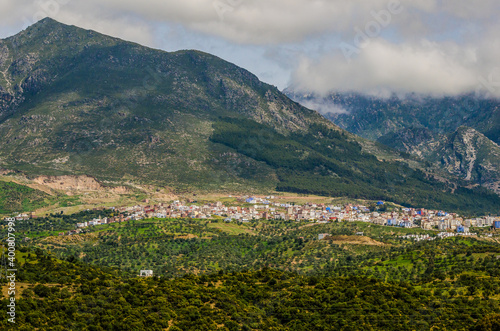 Panoramic view on the blue city of Chefchaouen in Morocco under the mountains © marketanovakova