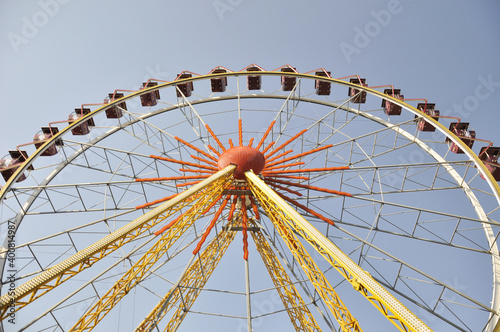 Yellow ferris wheel in an amusement park