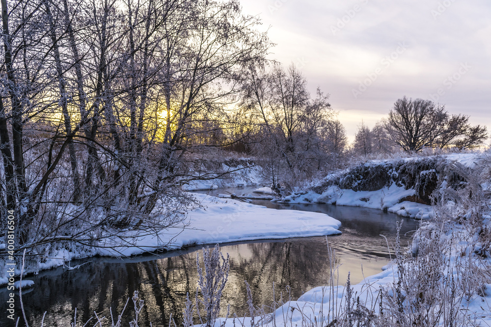 Evening twilight on the Bank of the winter river. Evening twilight on the Bank of the winter river.