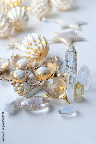 gemstones crystal minerals and christmas decor on white background. winter season holiday composition. Magic Rock for Crystal Ritual, Witchcraft. Healing stones. 