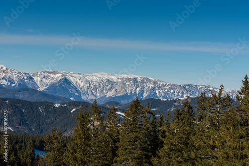 high mountains with snow and blue sky while hiking