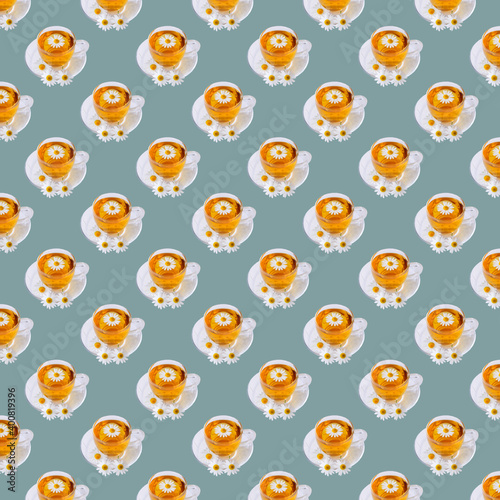 Seamless minimalistic pattern of cups of tea on a grey background. Pop Art. Postcard. Printing on fabric. Wrapping.
