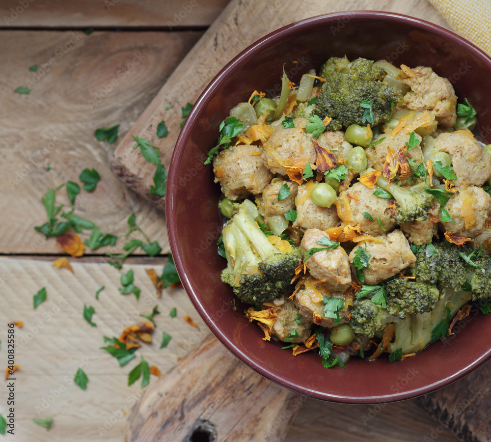 Soy goulash, protein food with stewed vegetables pea, broccoli, carrot