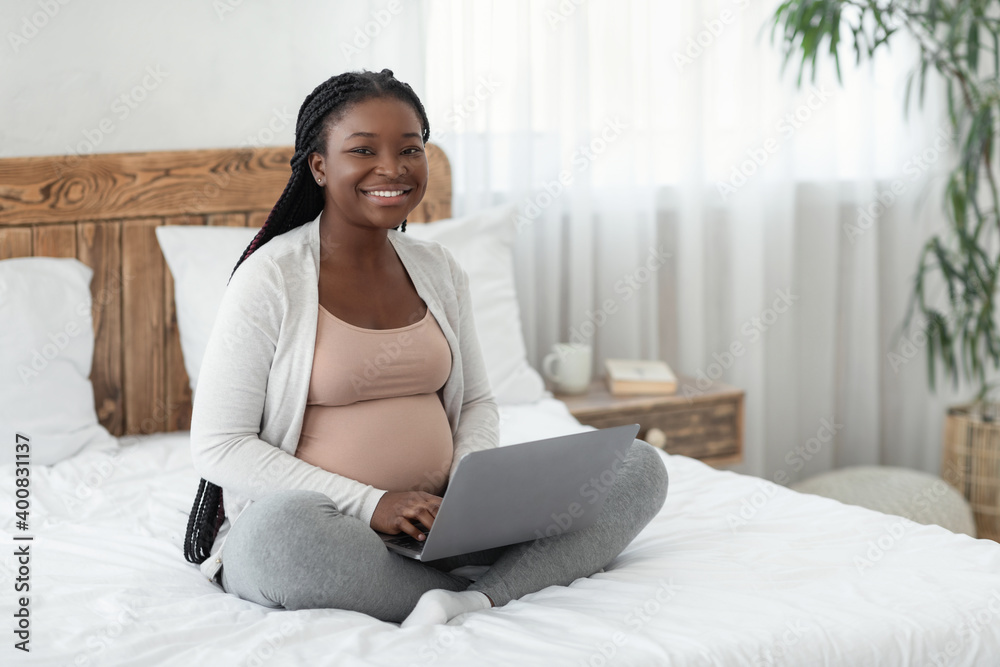 Online Jobs For Pregnant Women. Black Expectant Mother Using Laptop At Home Online Jobs For Pregnant Women. Black Expectant Mother Using Laptop At Home