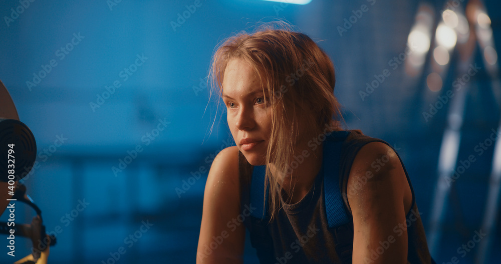 Tired female factory worker after difficult day Tired female factory worker after difficult day