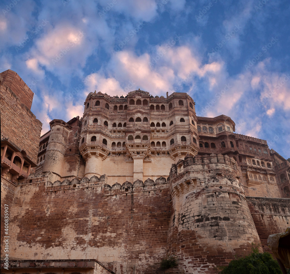 Exterior of famous Indian Mehrangarh Fort at sunset in Jodhpur, Rajasthan, India. Built in 1459, the fort is situated 125 m above the city.